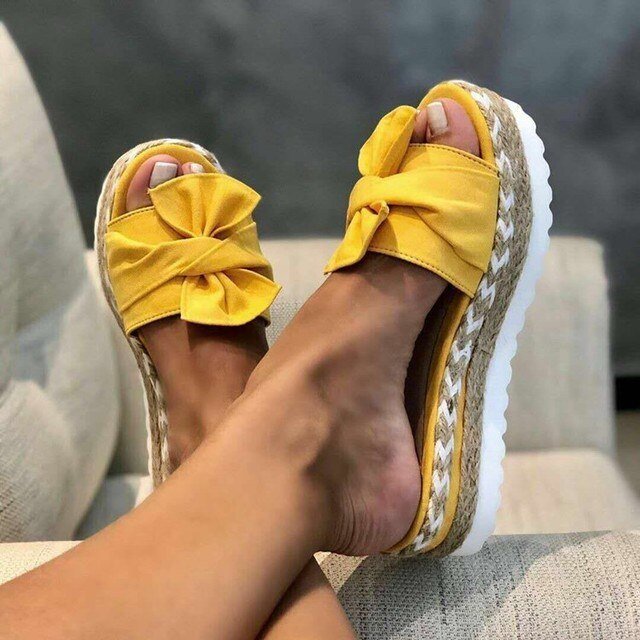 Women's beige woven wedge sandals with bow detail and platform heel