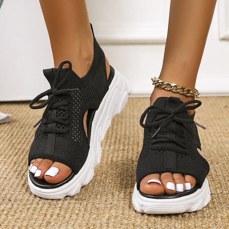 Women's black knit platform sandals with lace-up front and cushioned sole