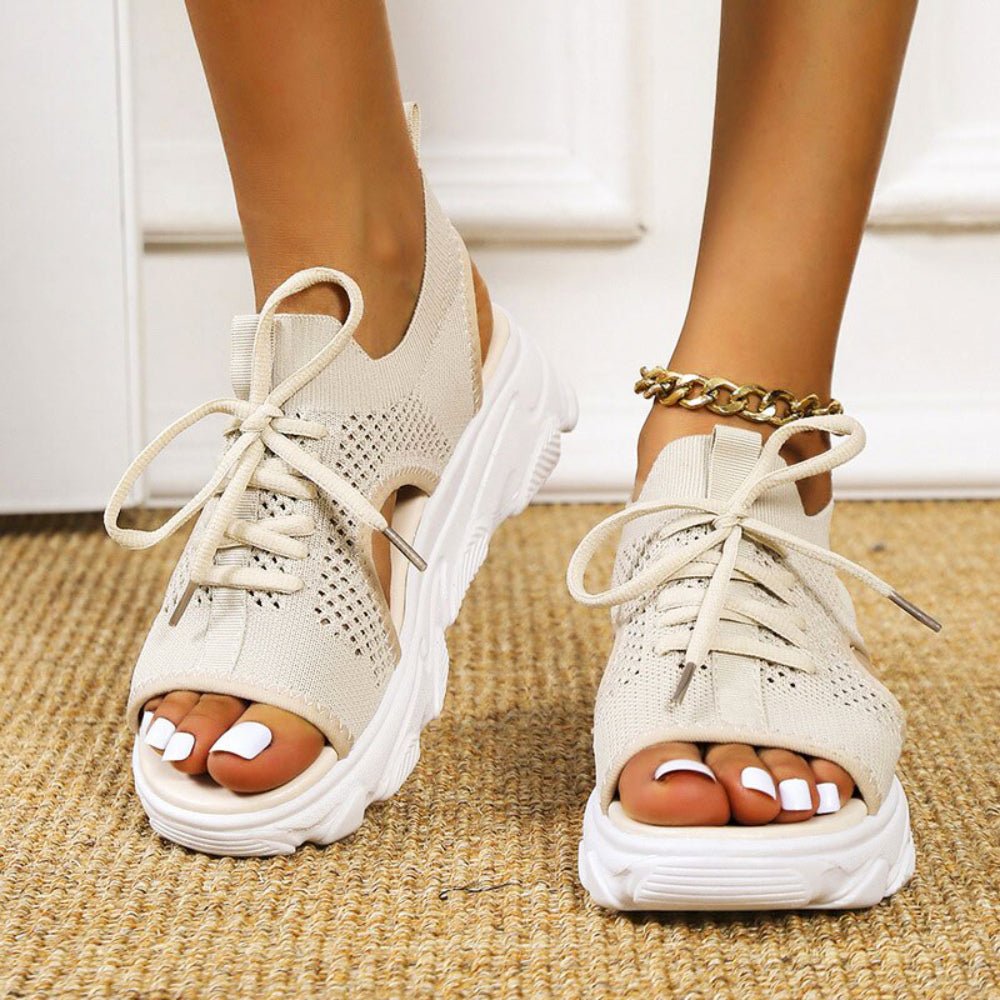 Women's black knit platform sandals with lace-up front and cushioned sole