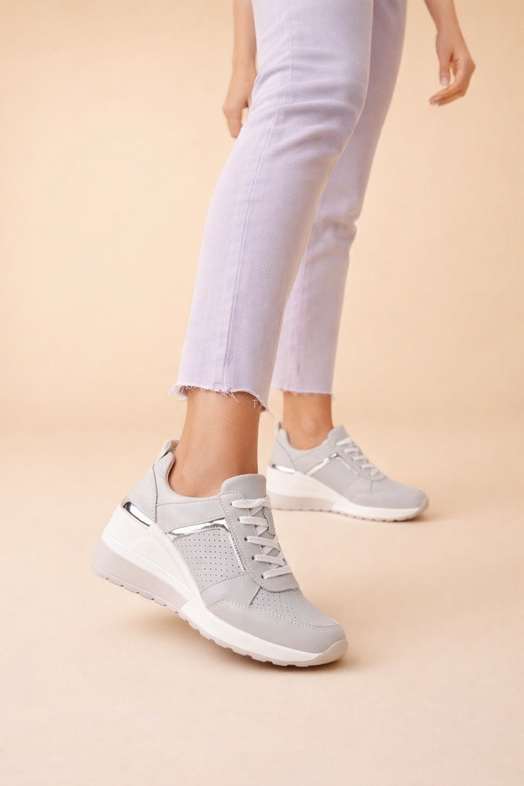 Women's white hidden wedge sneakers with perforated lace-up upper