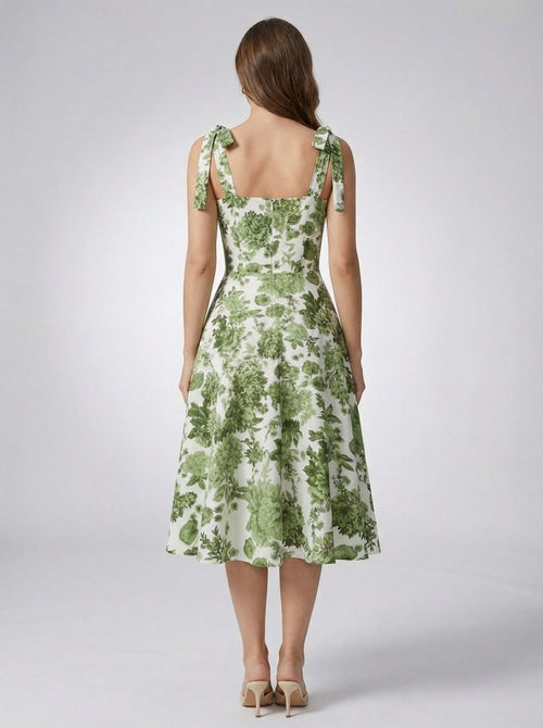 Women's green floral a-line dress with fitted bodice and flared skirt