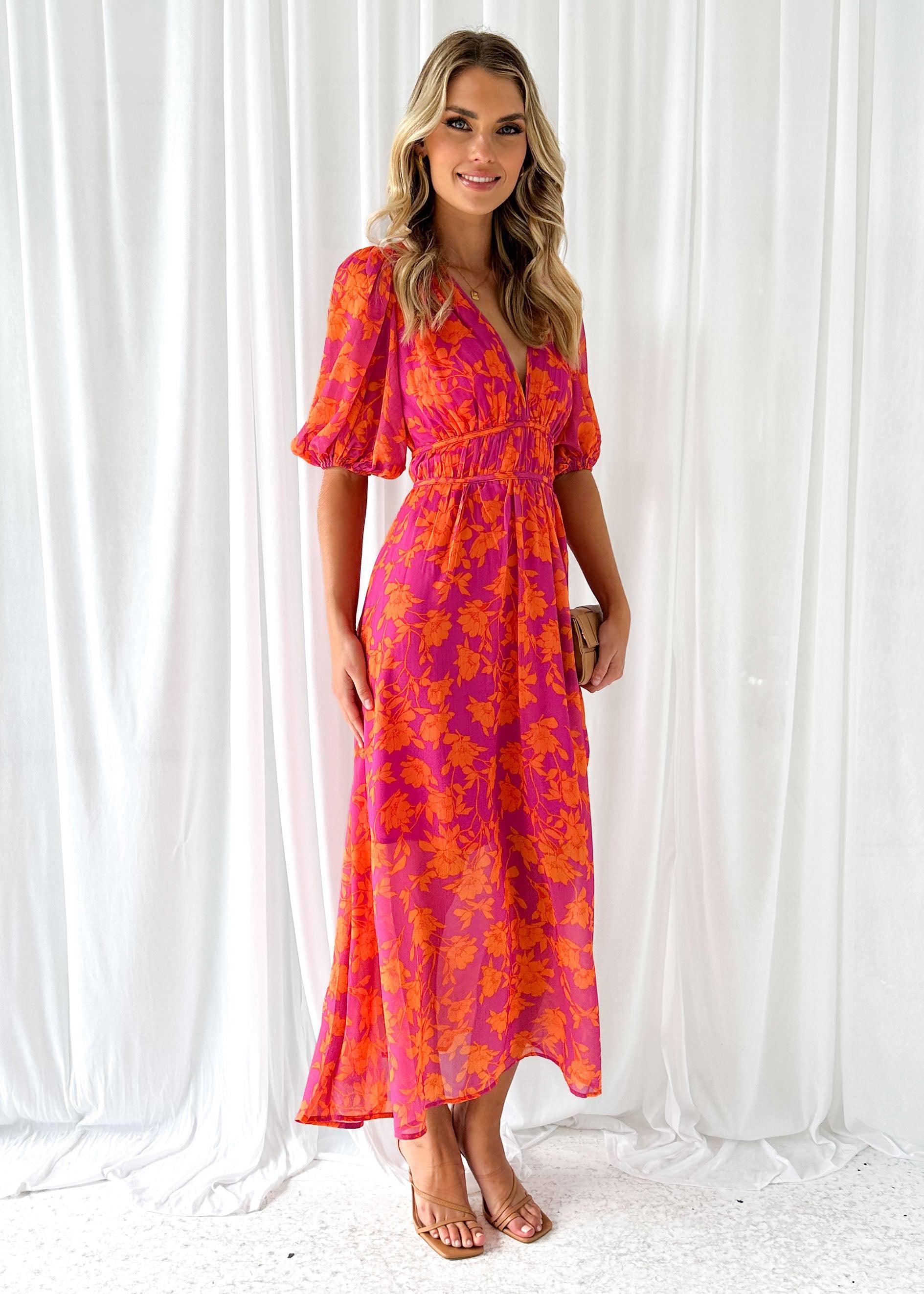 Women's floral maxi dress with deep v-neck and flowing skirt