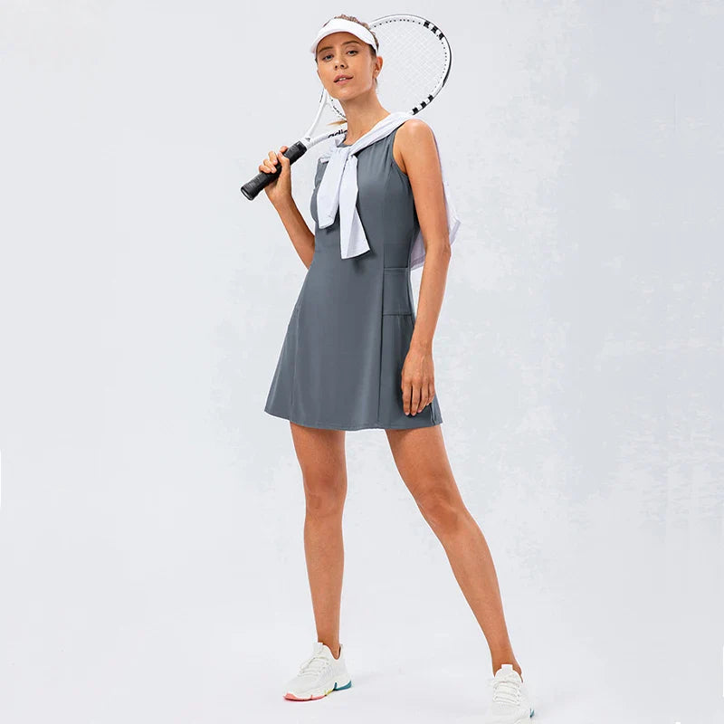 Women's grey tennis dress with built-in shorts and stretch fabric
