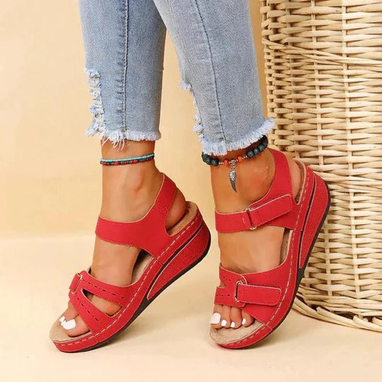 Women's red walking sandals with adjustable twin straps and flat footbed