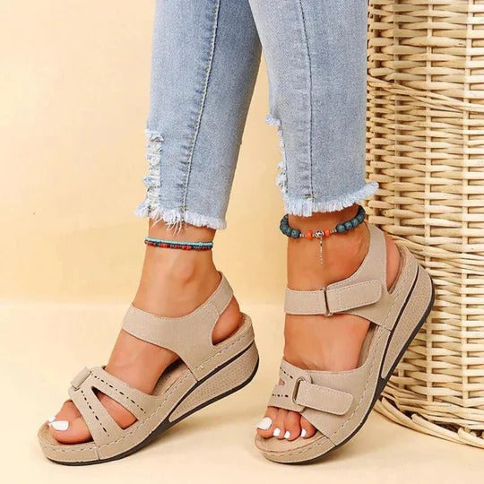 Women's beige walking sandals with adjustable twin straps and flat footbed